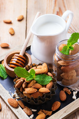 Almond milk with ingredients for healthy breakfast