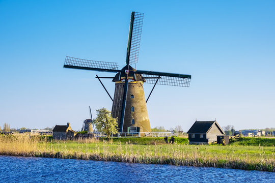 Netherlands, South Holland, Kinderdijk, UNESCO World Heritage Site. Historic Dutch windmill on the polders.