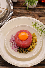 Beef tatare with egg, onion, cucumber and capers