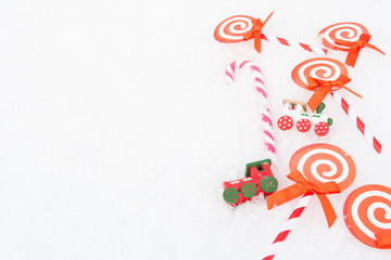 Fototapeta premium Christmas paper candy, real candy and two trains. Copy space