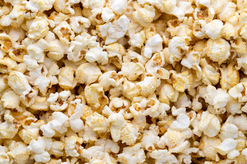 Popcorn background. Caramel sweet corn. Cinema snack.