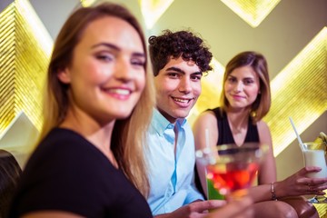 Portrait of happy friends in nightclub