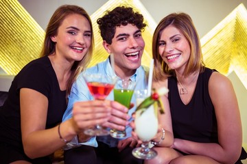 Portrait of happy friends in nightclub