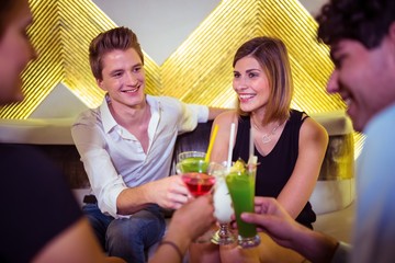 Joyful friends enjoying in nightclub