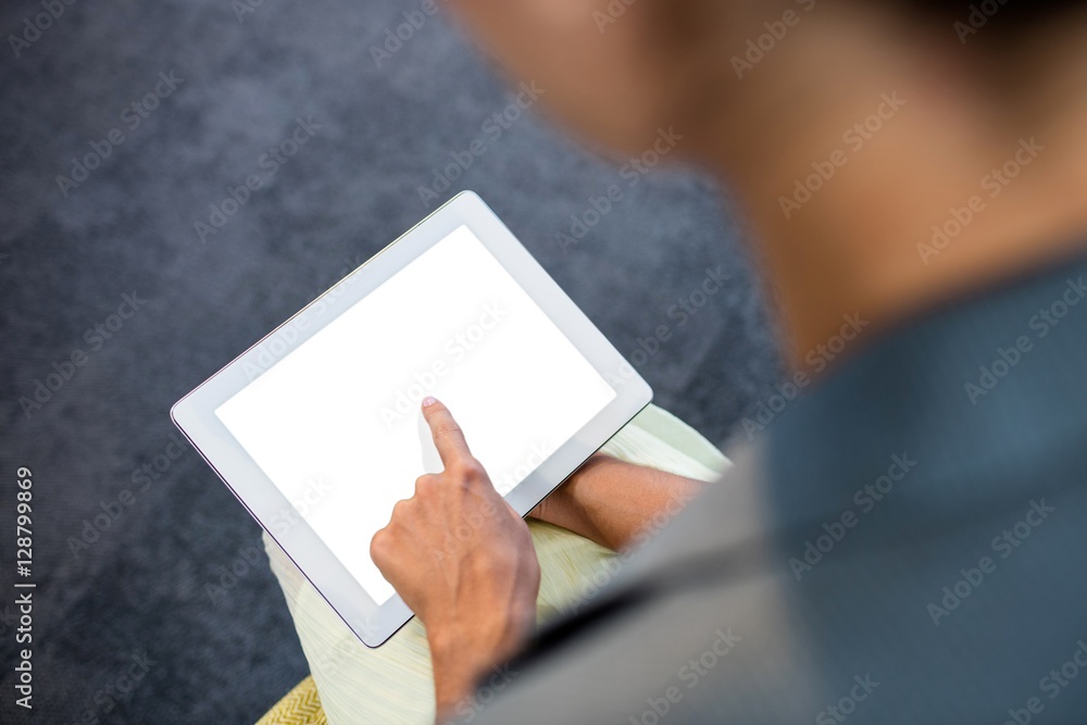 Poster Focus on background of hand using a tablet