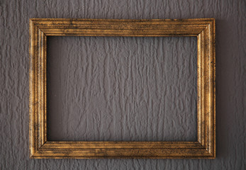 Wooden vintage frame on dark wall