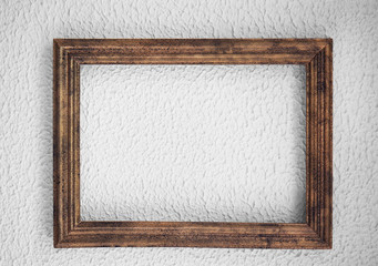 Wooden vintage frame on color wall