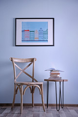 Simple interior with stool and decorations on blue wall background