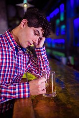 Sad man at bar counter