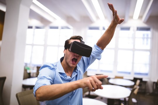 Executive enjoying augmented reality headset at office