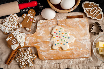 cooking christmas gingerbread on wooden background top view