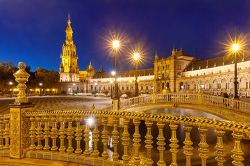 Naklejka premium Patterned fence of the bridge on the Spain Square or Plaza de Espana in Seville during evening blue hour, Andalusia, Spain