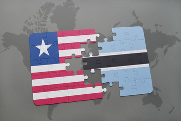 puzzle with the national flag of liberia and botswana on a world map