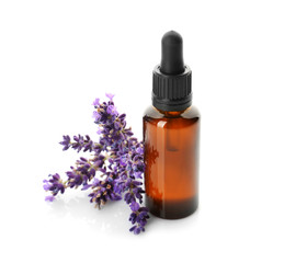 Bottle with aroma oil and lavender flowers isolated on white