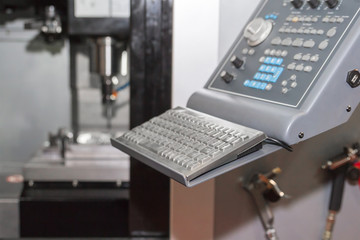 Fototapeta na wymiar High precision CNC machining center working, operator machining