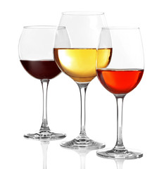 Three glasses with tasty wine on white background