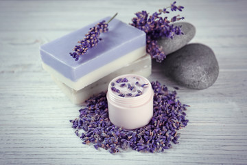 Fototapeta na wymiar Beautiful composition of lavender cosmetics on wooden background
