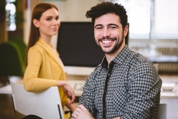 Happy businessman with female coworker