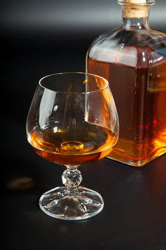 Glass of brandy and a carafe