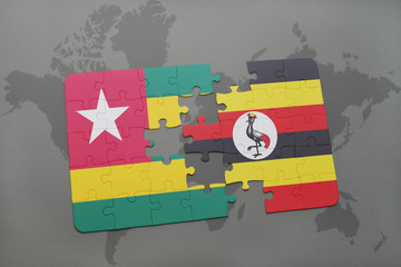 puzzle with the national flag of togo and uganda on a world map