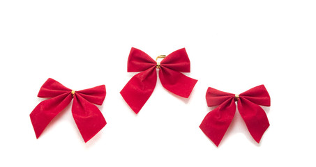 Decorative red ribbon and bow on a background of white backgroun