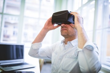 Graphic designer using virtual reality headset 