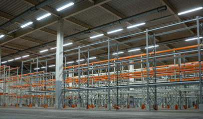 Interior of a warehouse with racks.