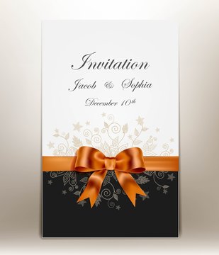pretty wedding invitation with ribbon and bow.