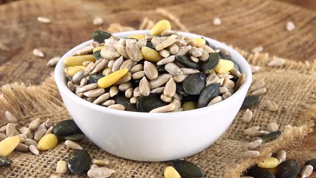 Mixed Seeds (rotating on a wooden plate; seamless loopable; 4K)