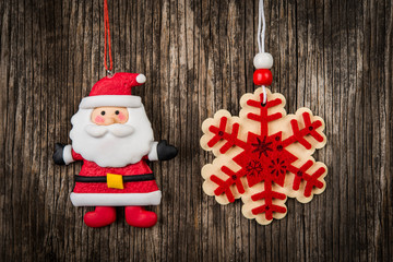 Red Christmas ornaments hanging on wooden branch