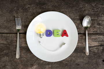 Big light bulb idea glowing with smile