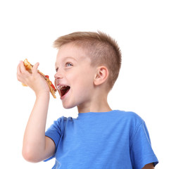 Cute boy eating pizza, isolated on white