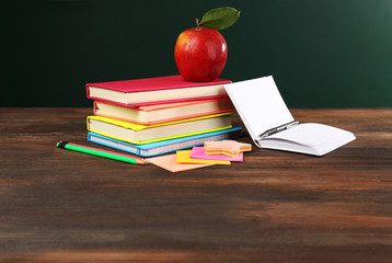 Back to school concept with apple, books and accessories