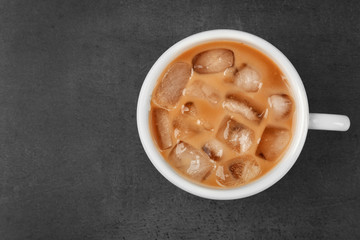 Iced coffee with milk on grey background
