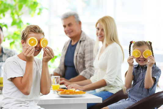 Happy Large Family Having Breakfast On Kitchen