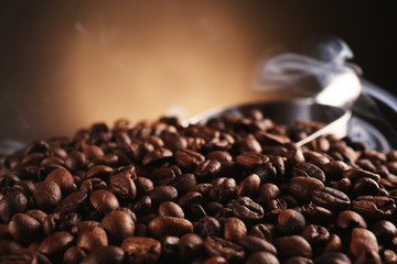 Fresh coffee beans on blurred background