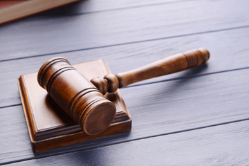 Gavel with sound block on wooden background