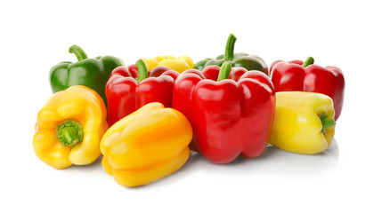 Set of sweet red, yellow and green peppers on white background