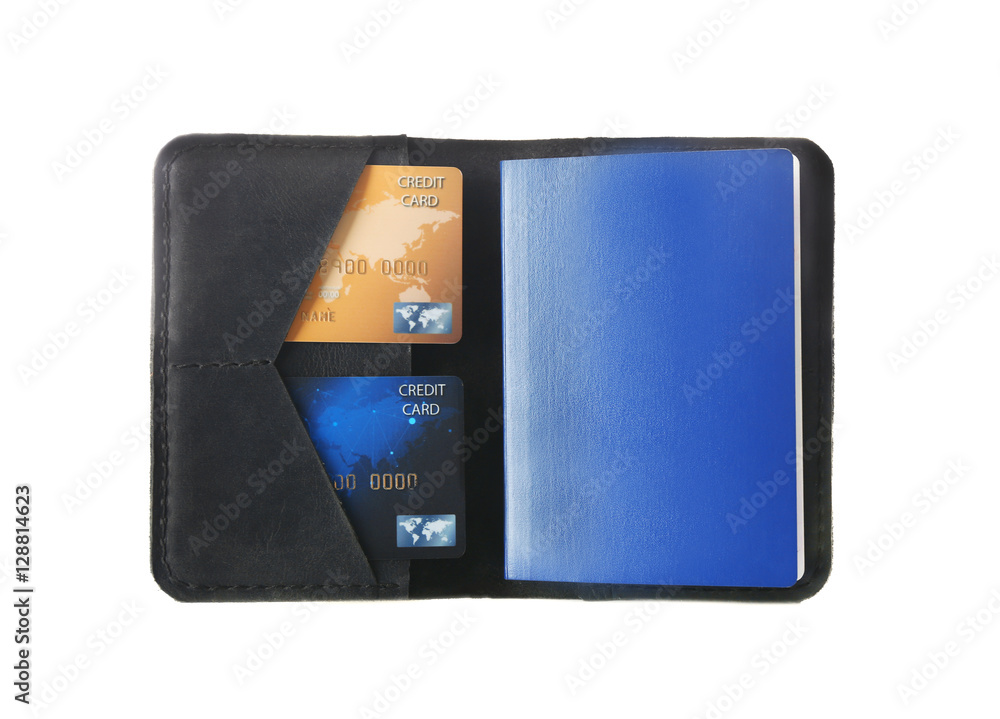 Wall mural Opened black leather wallet with passport and credit cards isolated on white