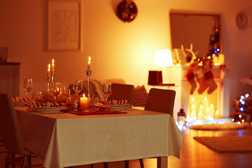 Table served for Christmas dinner in living room