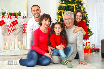 Happy family in living room decorated for Christmas