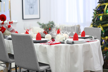 Table served for Christmas dinner in living room