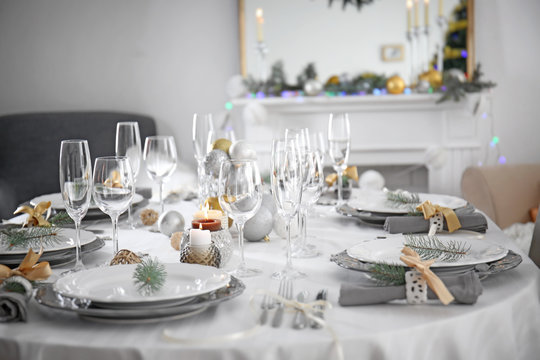 Table served for Christmas dinner in living room, close up view