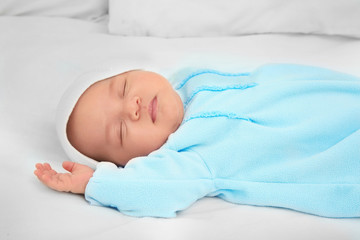 Cute baby sleeping on bed