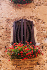 Fototapeta na wymiar window at an old building in San Gimignano