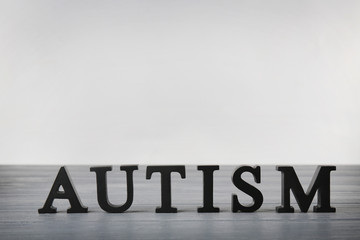 Autism word on light background