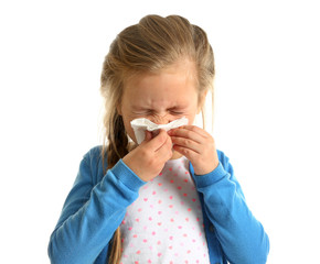 Cute little girl blowing nose on white background