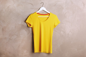 Blank yellow t-shirt on grunge background