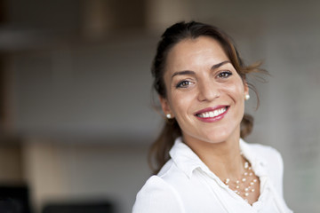 Spanish Businesswoman Smiling At the Camera. At the office.