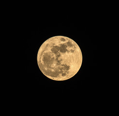 Full moon over dark black sky at night